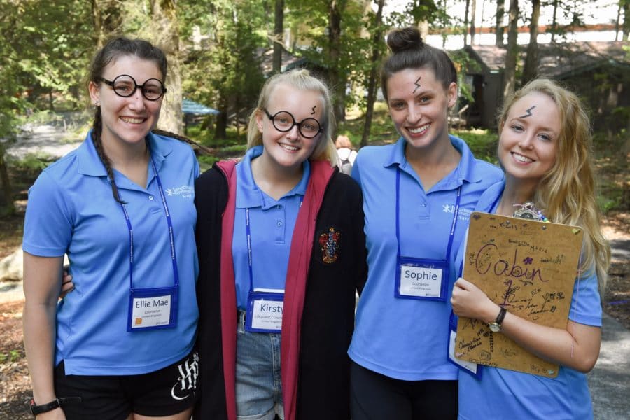 Staff members with name tags smiling for photo