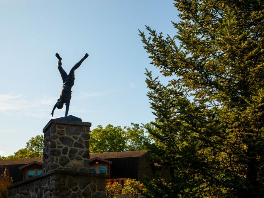 statue of a younger gymnast doing a one-handed handstand