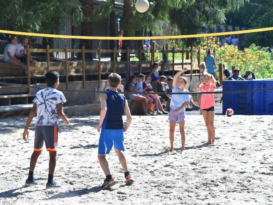 kids playing volleyball at camp