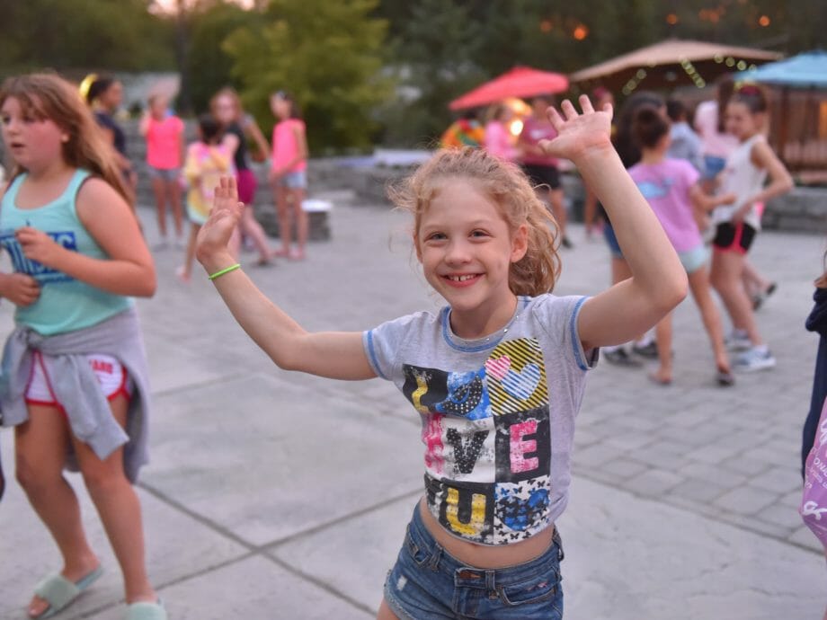 girl dancing during evening activities