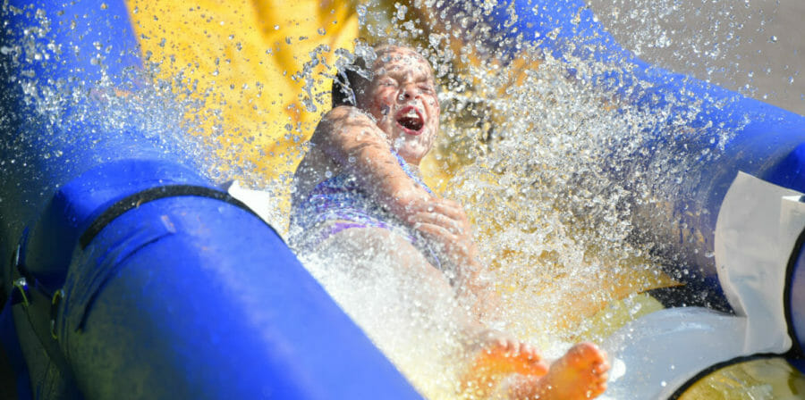 a girl going down a water slide
