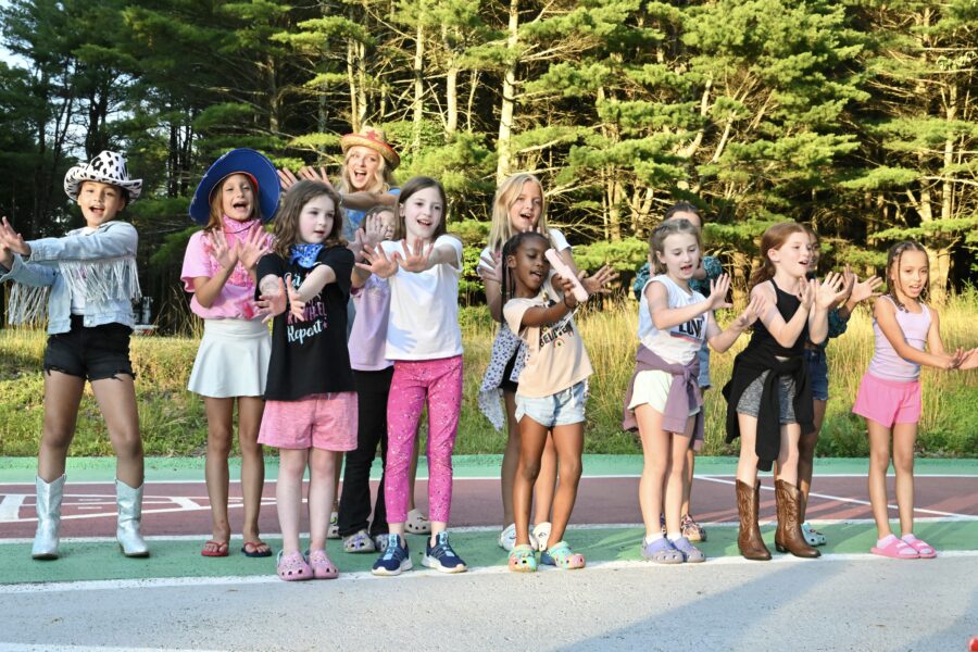 a group of girls having fun at gymnastics camp