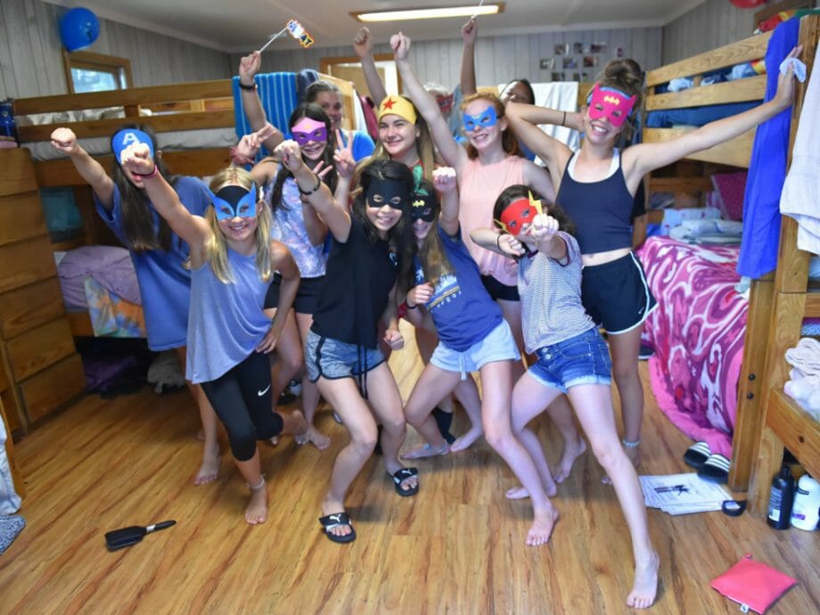 girls in their cabin dressed as superheroes