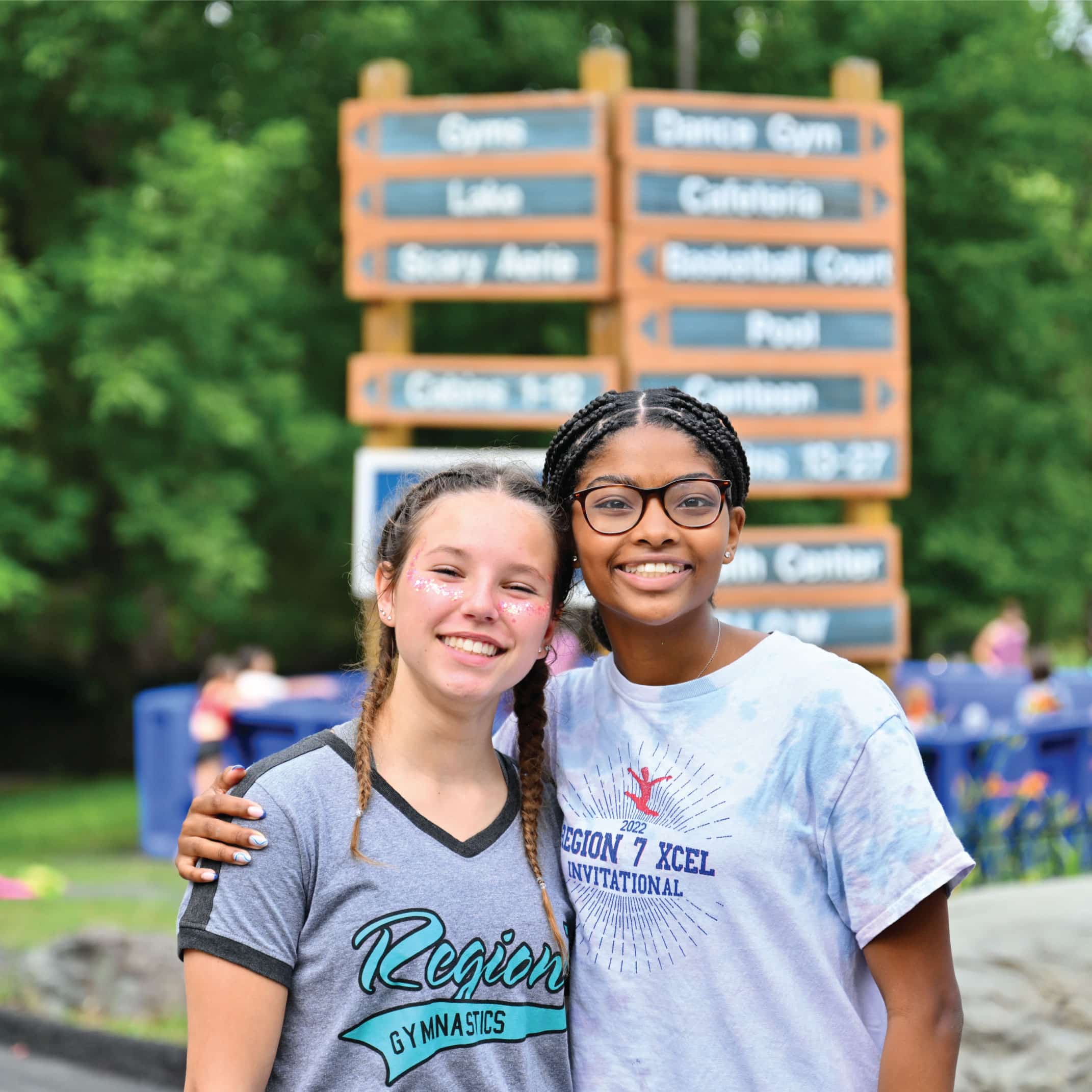 two campers smiling for the camera